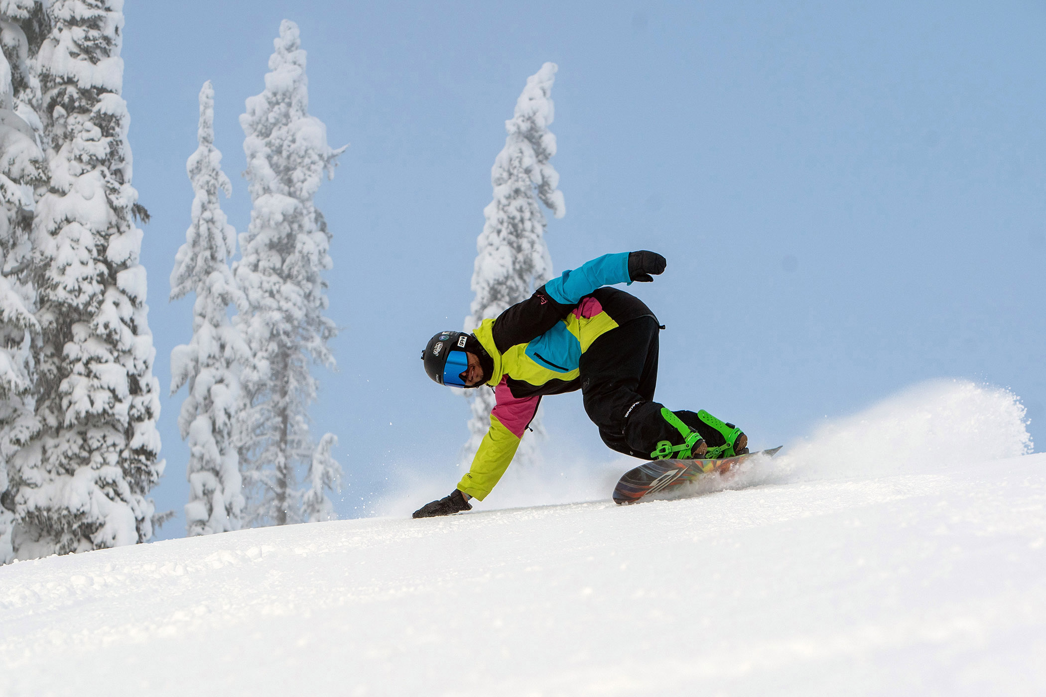 Snowboarder descends a groomer at Lookout Pass. 